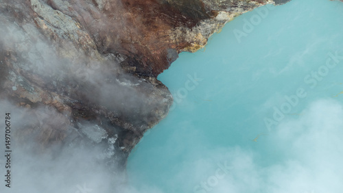 aerial view of the interior of a volcano crater, with a lake of sulphur. Java, Indonesia - 19th March 2025
