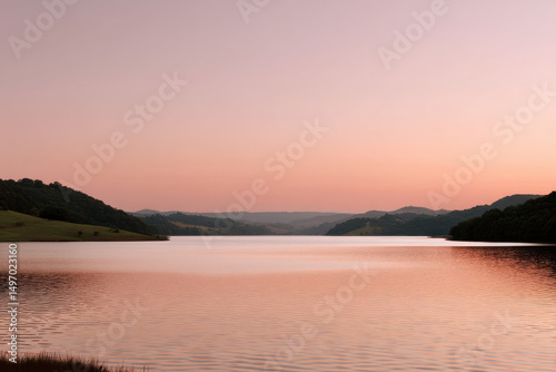 serene summer dawn at tranquil lake sky painted in soft pastels as sun rises