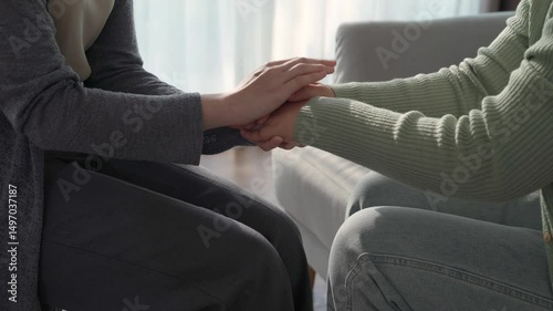 Psychologist, friend or family holding hands to encourage patient with depression, anxiety, therapy session, mental health concept