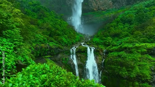 Lush Green Valley with Multi-Tiered Waterfalls in India During Monsoon