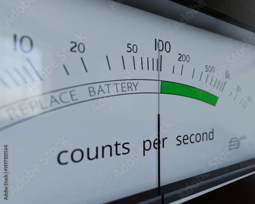 Geiger counter analogue meter closeup. Meter is showing  almost 100 cps (counts per second), equivalent to 6000 counts per minute.