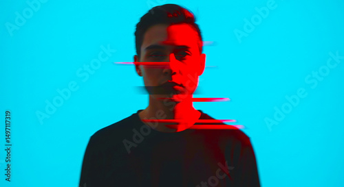 A man with half his face illuminated by red light against a bright blue background with glitch effect