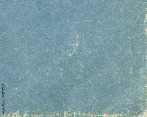 Old grunge blue book cover background. Texture of vintage cardboard.