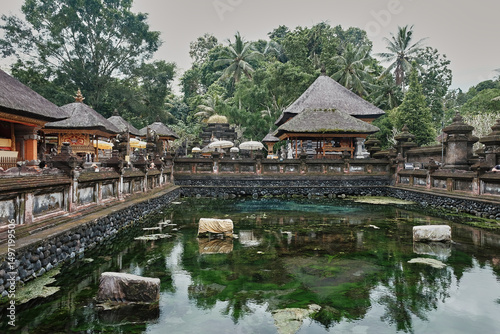 Tirta Empul temple complex with serene water features in Bali, Indonesia during the early morning