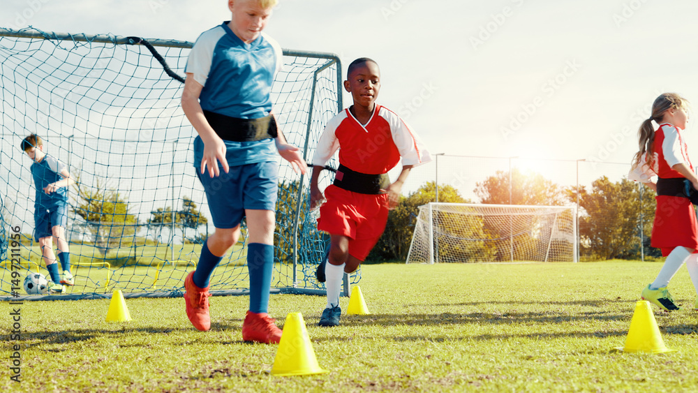 Obraz premium Kids, running and drills for soccer practice for strength training, fitness exercise and sports workout. Children, equipment and resistance for endurance, speed challenge and team for cardio routine