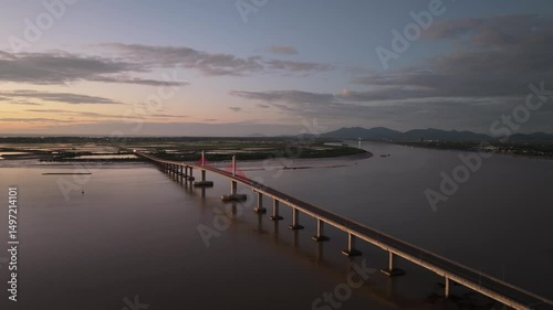 Wallpaper Mural Cua Hoi bridge spans over estuary at sunset in Vinh city, Nghe An, Vietnam, showcasing structural elegance and natural beauty Torontodigital.ca