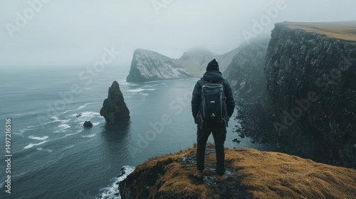 Solitary Figure at Dramatic Coastal Cliffs, Iceland