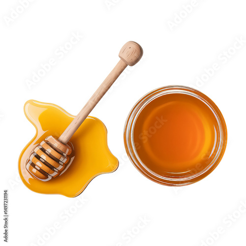 Overhead shot of honey dipper on spilled honey and a jar of honey 