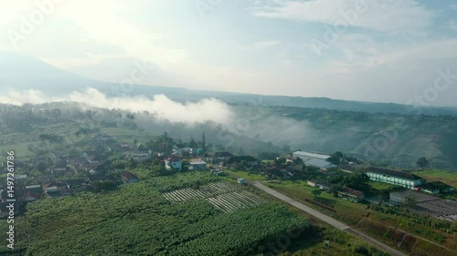 4K UHD Drone Footage of Tranquil Mountain Village at Sunrise 


