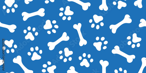 White dog paw footprint bones seamless pattern on blue background. Design for fabric, textile, wrapping, wallpaper.