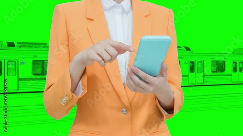 Smart Commuting: A stylish professional in an orange blazer navigates their smartphone, juxtaposed against the backdrop of a train.
