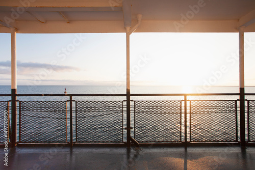 Sunrise over ocean seen from ferry photo