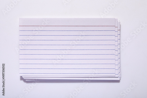Studio shot of stack of index cards on white background