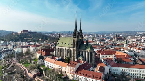 Brno, Czechia. Active Roman Catholic cathedral.  Originally medieval in gothic style, then many renovations, High towers added in Gothic revival between 1901-1909. Aerial view photo