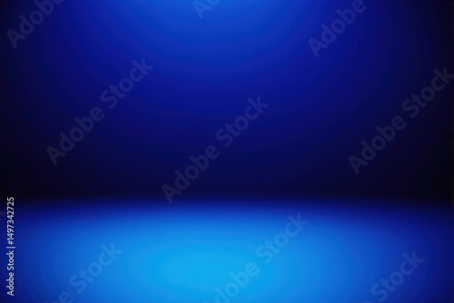 A blurry blue background featuring a central light source
