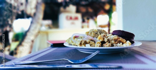 Caribbean Scrambled Eggs with Pickled Onions and Fried Plantain Patties at Outdoor Table