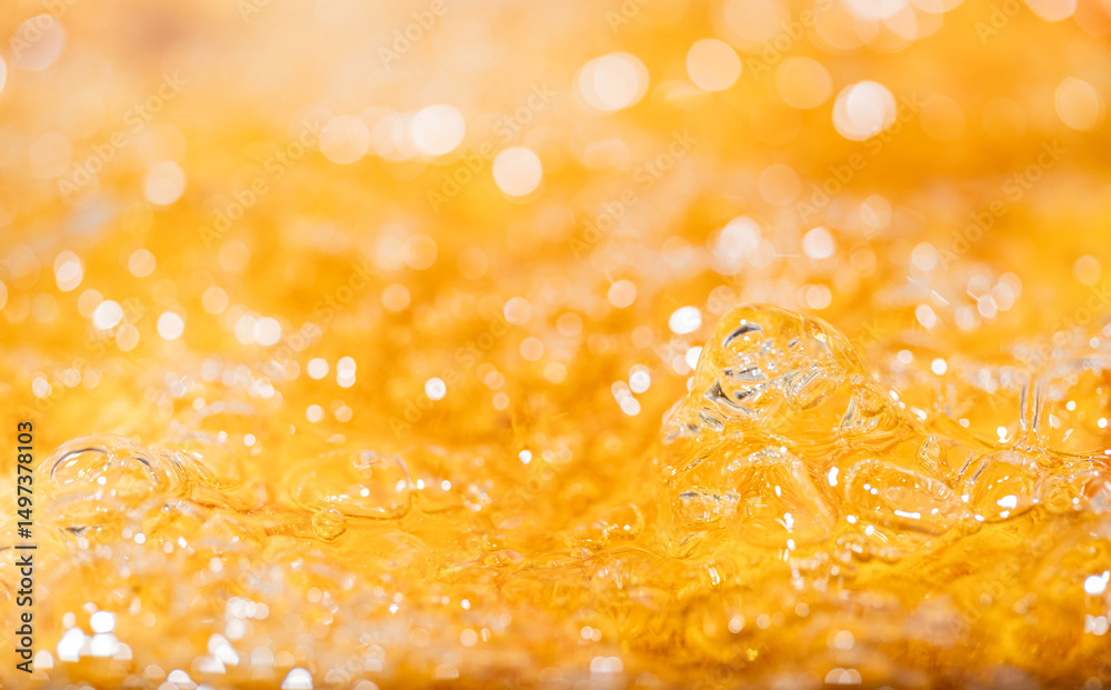 Close up bright orange Oil or beer splash texture and nature waves, Beautiful waves curve and little bubbles smooth for graphic design and background, Oil Bubbles, Soft beer bubbles, Selective focus Close up bright orange Oil or beer splash texture and nature waves, Beautiful waves curve and little bubbles smooth for graphic design and background, Oil Bubbles, Soft beer bubbles, Selective focus