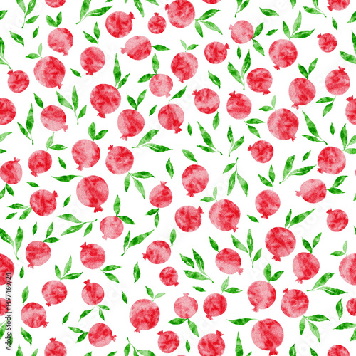 Bright red pomegranates and green leaves create a vibrant pattern on a white background