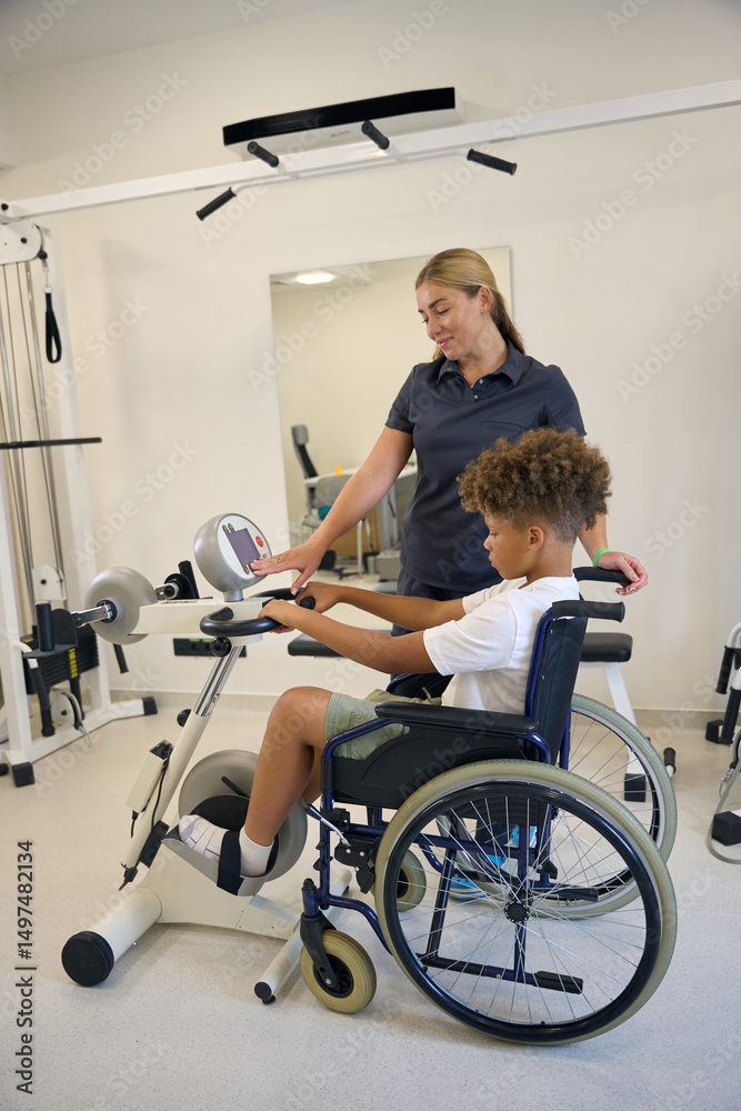 Female physiotherapist assists patient in their exercise routine Female physiotherapist assists patient in their exercise routine