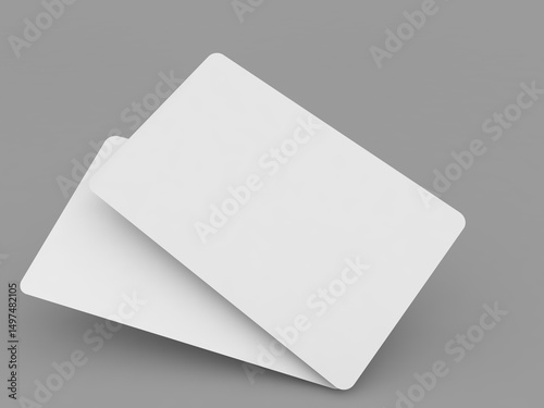 Blank identification cards stacked on a gray background ready for personalization or printing