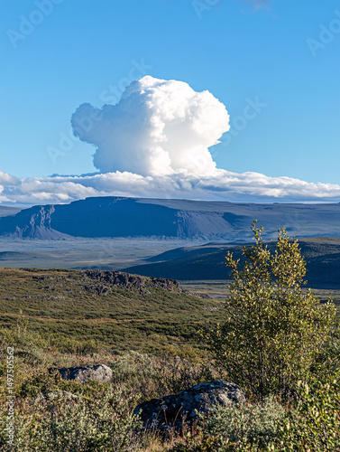 Majestic Cumulus Cloud Formation over Vast Mountain Landscape