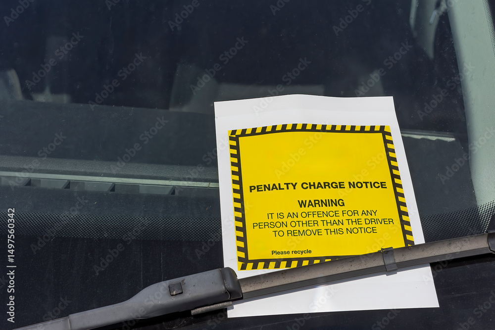 Fototapeta premium Yellow and White Penalty Charge Notice or Parking Ticket on Car Windscreen