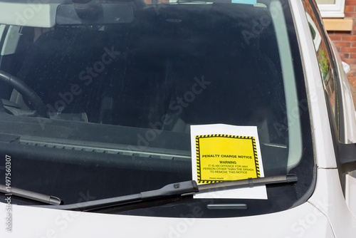 Billede på lærred Yellow and White Penalty Charge Notice or Parking Ticket on Car Windscreen