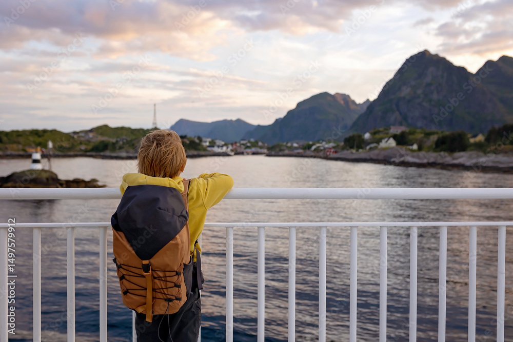 Fototapeta premium People, enjoying ferry ride between Bodo and Lofoten Moskenesoya summertime, child and adults on a ferry