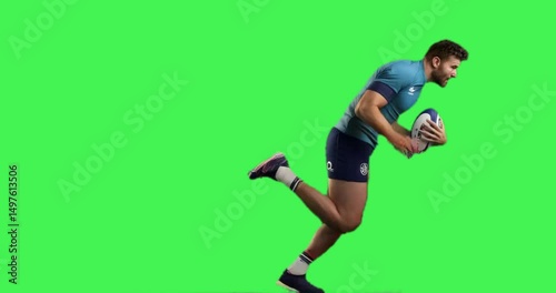 american footbal player running while carrying the ball in green screen