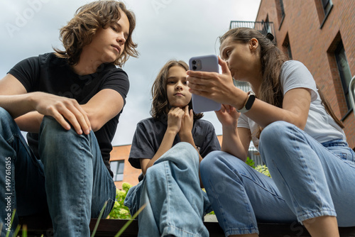 Mom guides her two teen sons on smartphone rules and social network best practices. They discuss online safety, digital citizenship, and healthy tech habits for navigating social media.