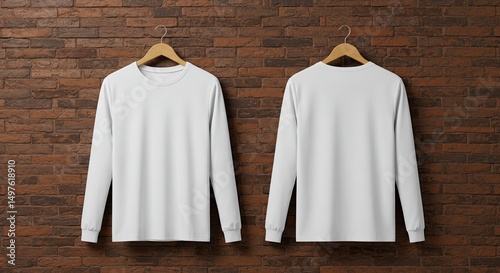 White Long Sleeve T-Shirt Mockup: Front and back view of a plain white long sleeve t-shirt hanging on wooden hangers against a rustic brown brick wall. Perfect for showcasing your designs or branding.