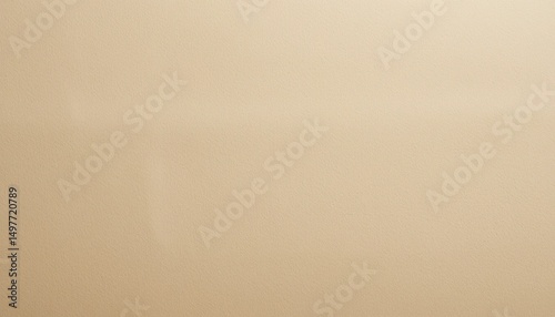 A simple light brown background with subtle variations in tone and a smooth, uniform appearance overall