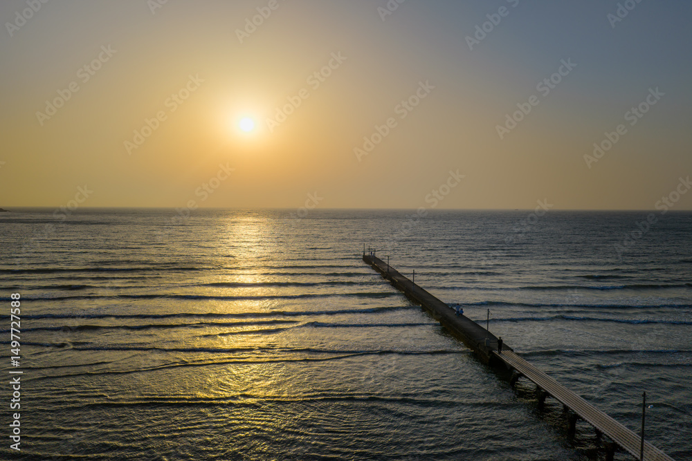 Obraz premium Sunset View of Haraoka Pier with Visitors Enjoying the Ocean, Chiba, Japan