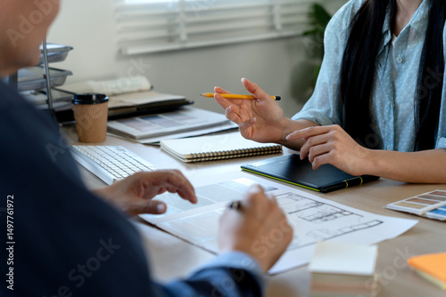Fotografie Designers and architects man and woman  are brainstorm discussing revisions