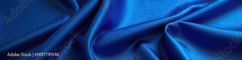 Close-up view of luxurious, deep blue fabric with subtle texture and sheen, ideal for fashion, design, and textile backgrounds  The rich color is captivating and elegant ,  waves,  wallpaper photo