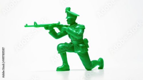 Green toy soldier in action pose, perfect for military-themed designs and projects.