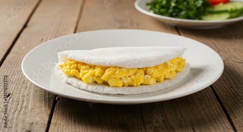 Brazilian Tapioca with Scrambled Eggs on White Plate, Healthy Morning Meal