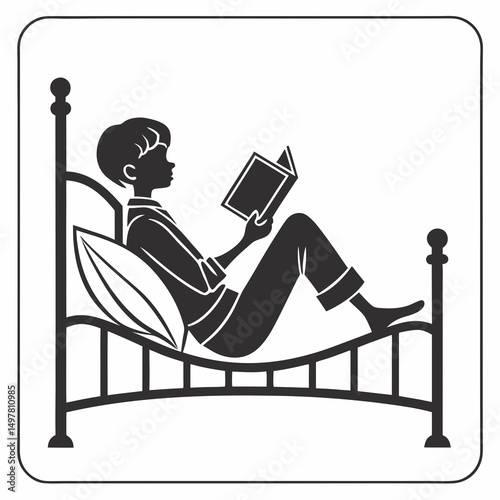 Boy relaxing in bed reading a book bedtime story sleep