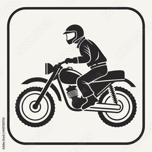 Silhouette of a motorcyclist riding a vintage motorcycle