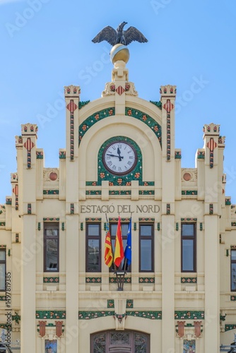 Estacio Del Nord Main Facade With grand Clock And Eagle sculpture, Historic Valencia Train Station, Estacion del Norte, North Station