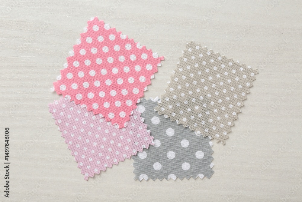 Obraz premium Samples of different fabrics on white wooden table, flat lay
