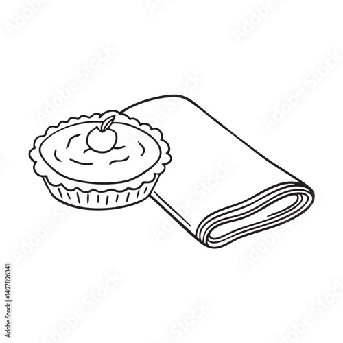 A tart lying beside a napkin