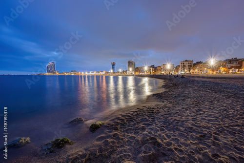 The beach of Barceloneta in Barcelona, Spain, at twilight