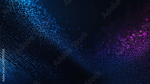 Abstract blue and purple particles flowing on dark background