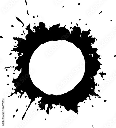 Tightly grouped ink splash creating a dense, compact design with a defined hollow circular center.