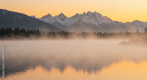 Mountain Range and Foggy Lake at Sunset