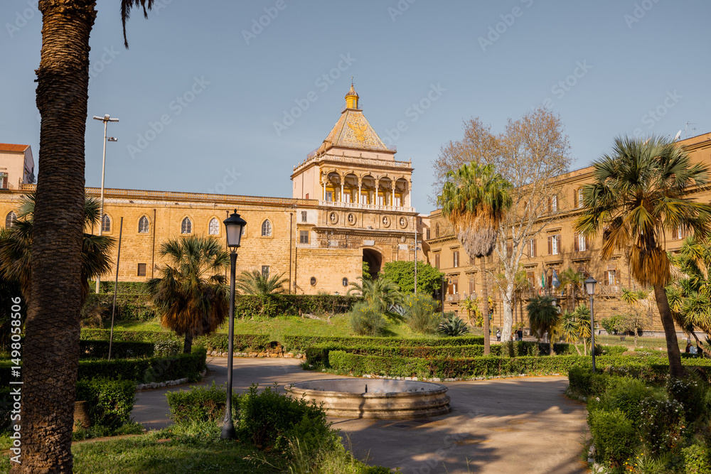Obraz premium A majestic view of Porta Nuova in Palermo, Sicily, where Renaissance architecture meets golden afternoon light. The historic gate frames the path to Palermos royal past