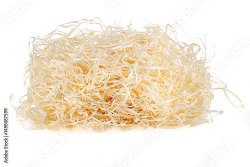 Wooden background. Close-up of wooden shavings for packaging isolated on white background.