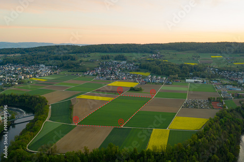 Land plot management - real estate concept with a vacant land on a green field available for building construction and housing subdivision in a residential area for sale, rent, buy or investment