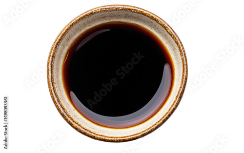 Bowl of coffee with a brown liquid in it